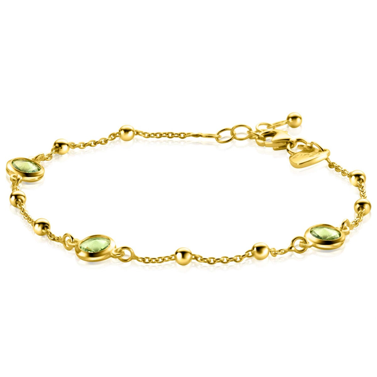 Gouden armband met groene edelstenen en bolletjes, verfijnde schakels en een sluiting.