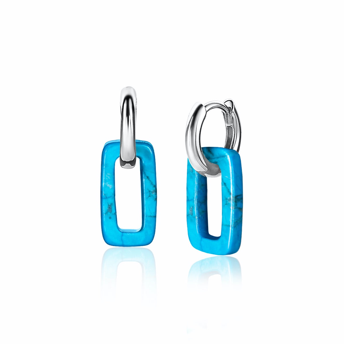 Zilveren oorbellen met een turquoise rechthoekige hanger en een glanzende afwerking.