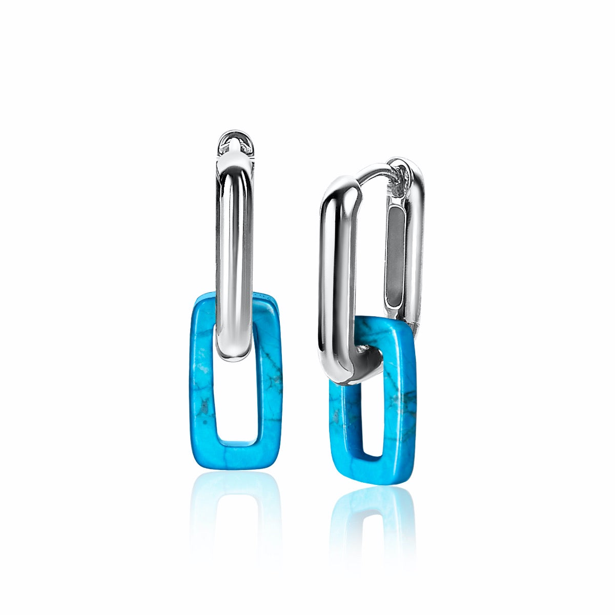Zilveren oorbellen met een turquoise rechthoekige hanger en een glanzende afwerking.